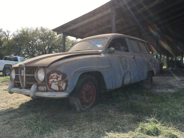 Here’s the second car. You can tell I took this picture before we tried moving it because the sun is still shining. You can also see the retched state of the tires. The back wheels are stuck in a rut formed by years of rain dripping off the barn roof. This car used to be under cover, but I think the owners tried pushing it out and said “Fuck it” when they got it this far.